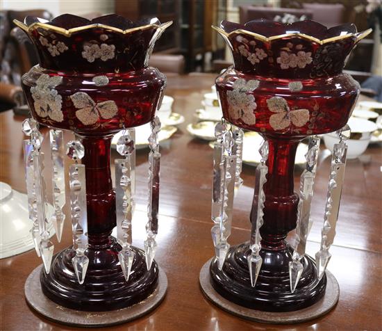 A pair of gilt floral ruby glass lustres